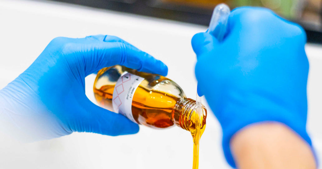 Maxence Moutte in the laboratory, creating perfume